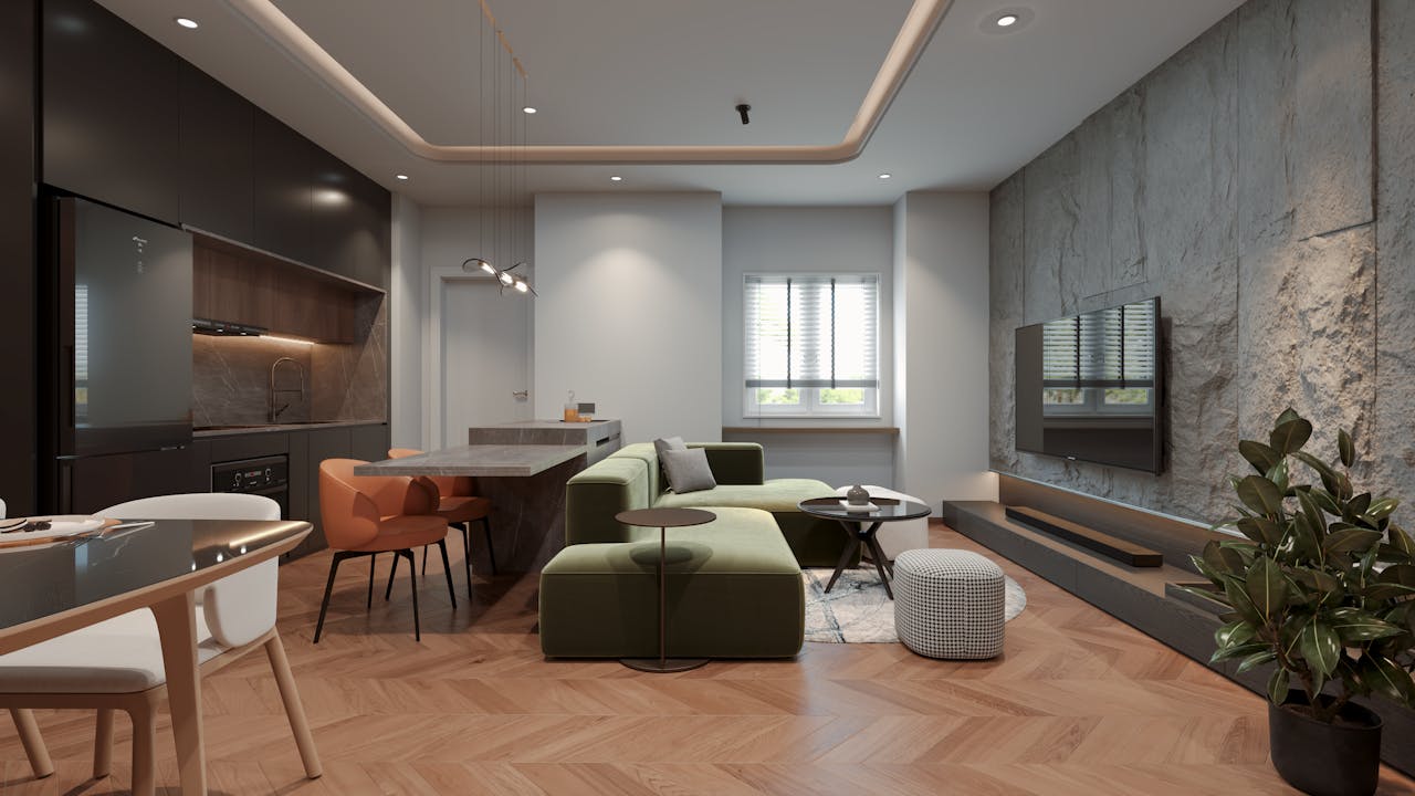 services-03 Elegant open-plan living room with green sofa and stylish kitchen setup, featuring natural light.
