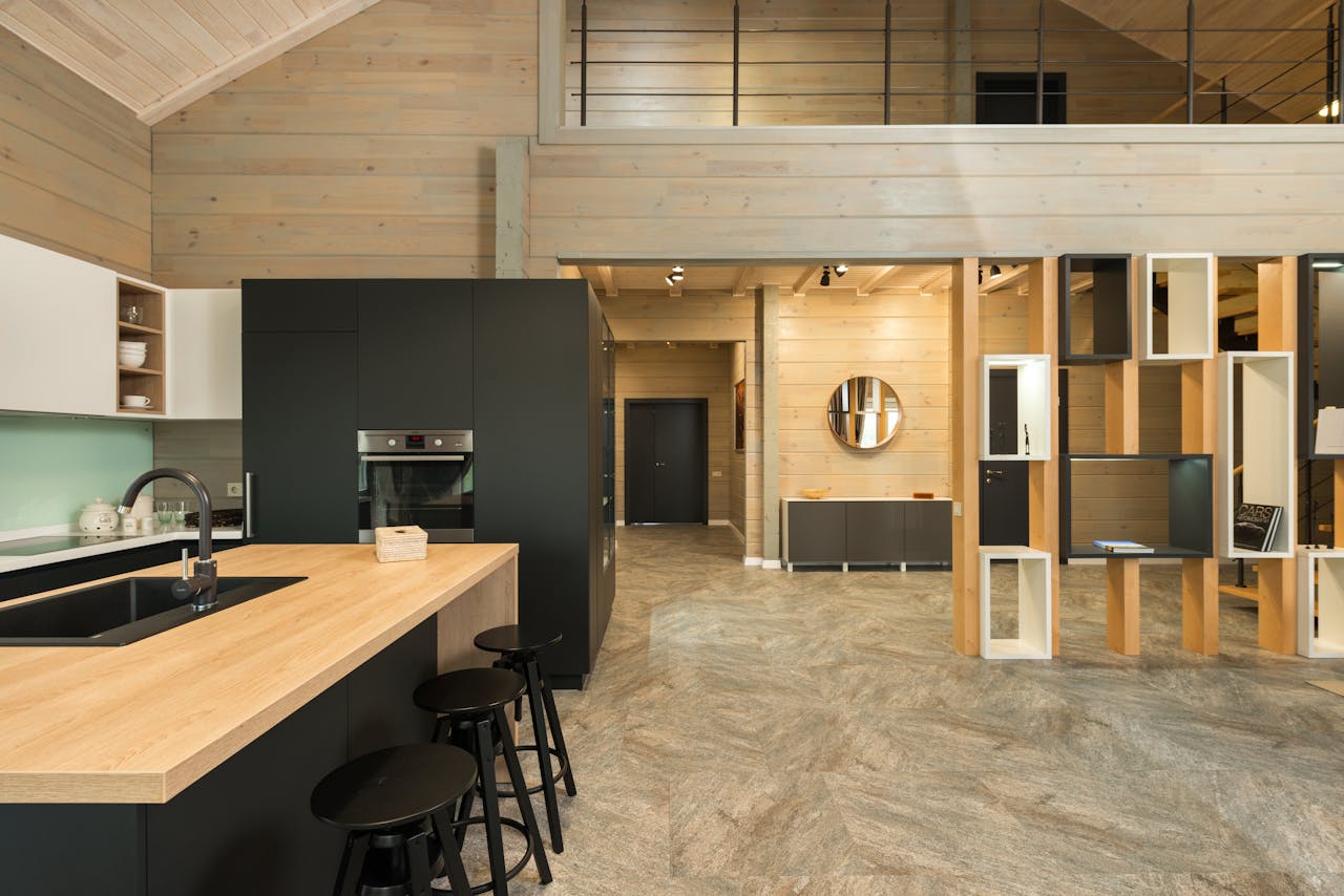services-02 Interior design of modern kitchen with matte cupboards and built in appliances in minimalist spacious private house